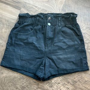 Black denim shorts. The brand is Elite Jeans and the size is medium.
